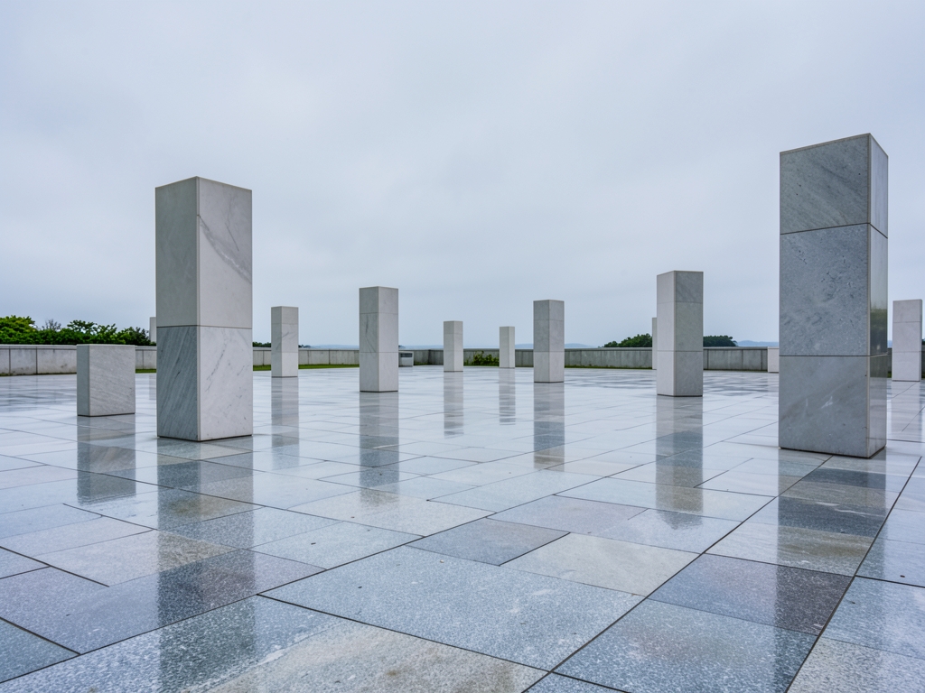 Smooth polished stone plaza under steady gray skies