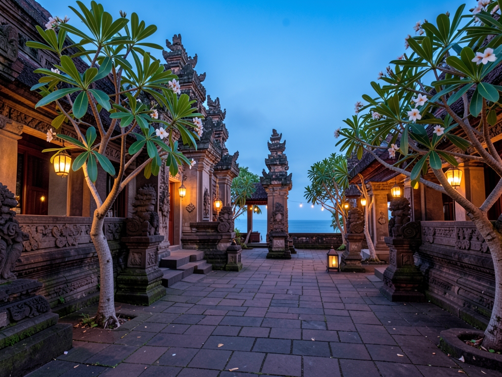 Open air Balinese temple courtyard dusk stone carvings frangipani