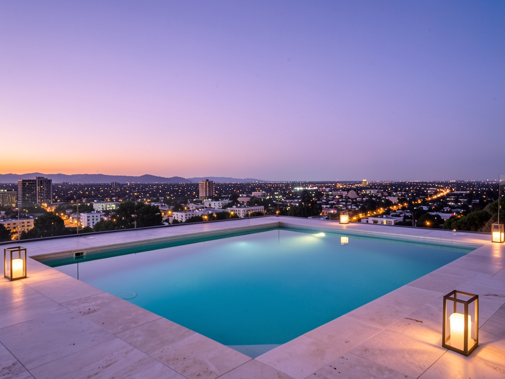 serene rooftop pool terrace dusk overlooking Angeles basin