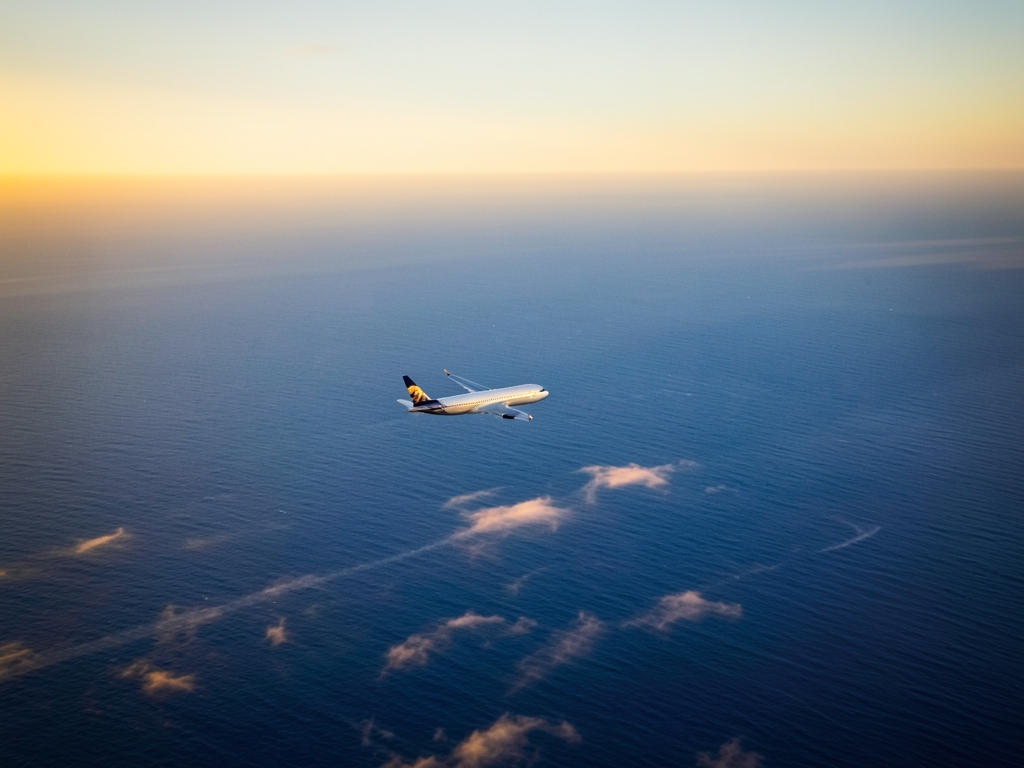 Aerial view transatlantic flight path over calm blue