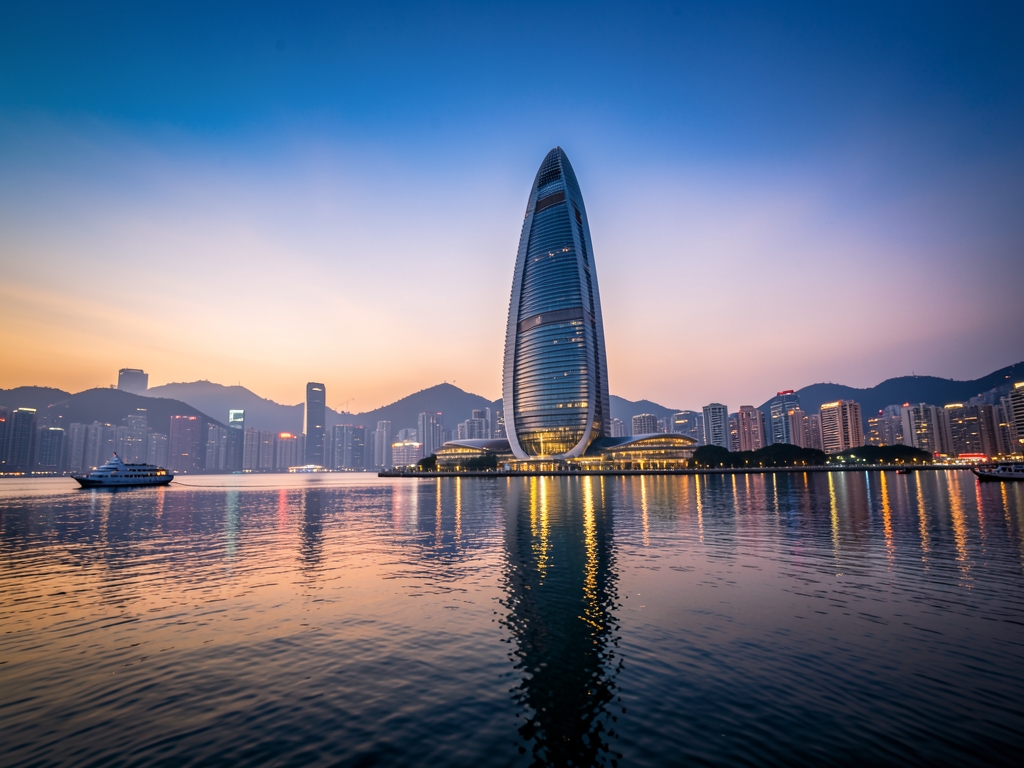 Hong Kong harbor twilight featuring iconic curved silhouette
