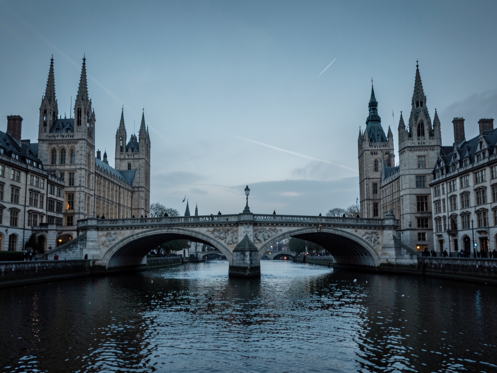 London riverside with historic stone bridge gothic towers