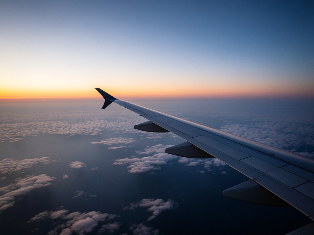 transatlantic flight path over North Atlantic dusk wispy