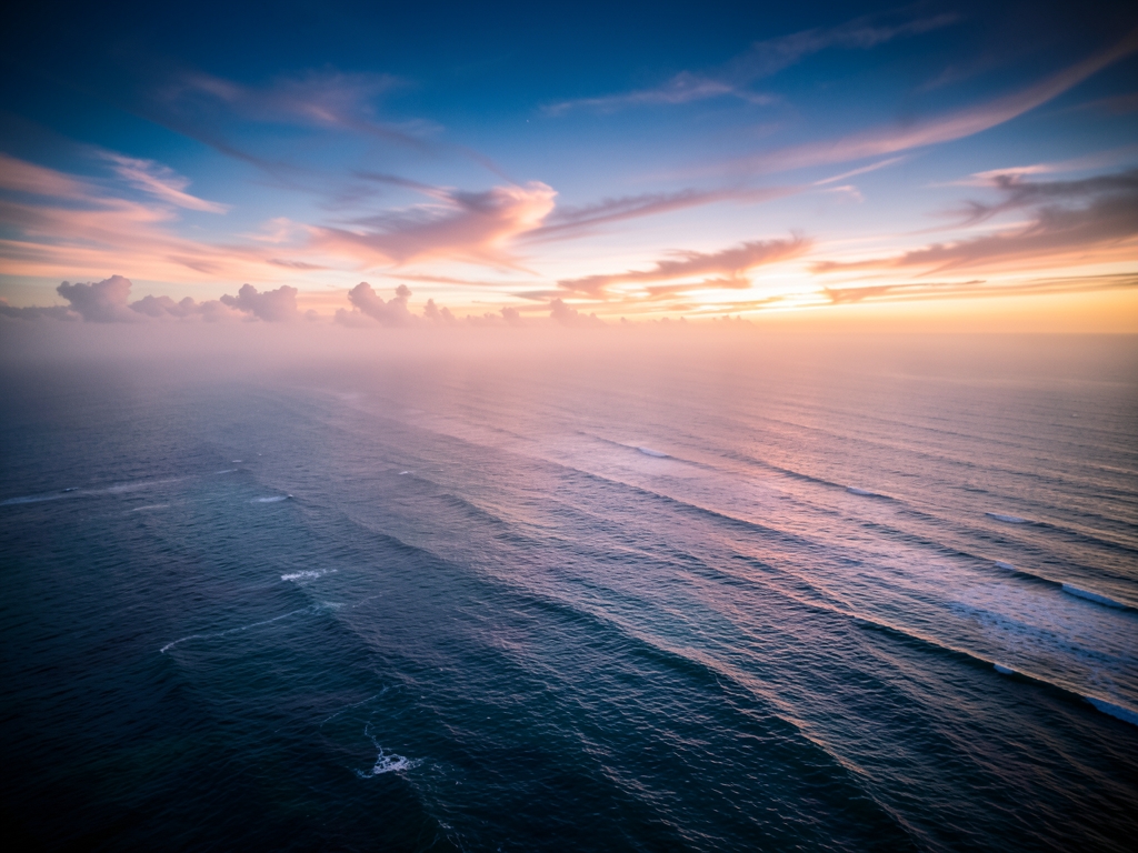 Aerial view over open Atlantic early dawn soft