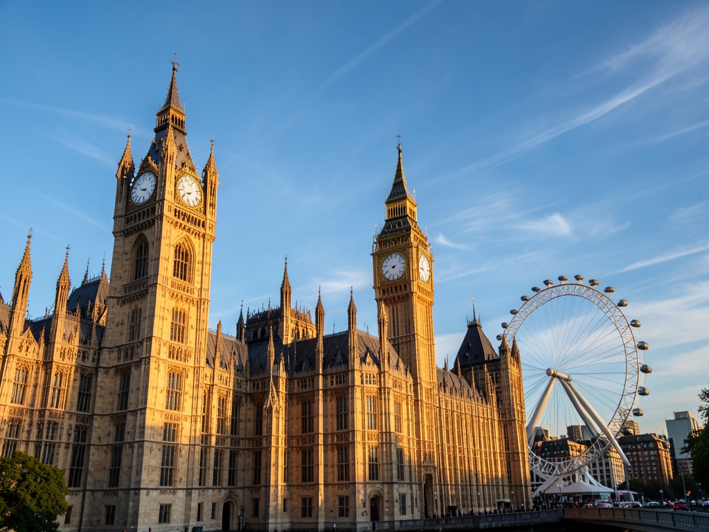 Golden sunlight illuminates intricate stone architecture London s skyline