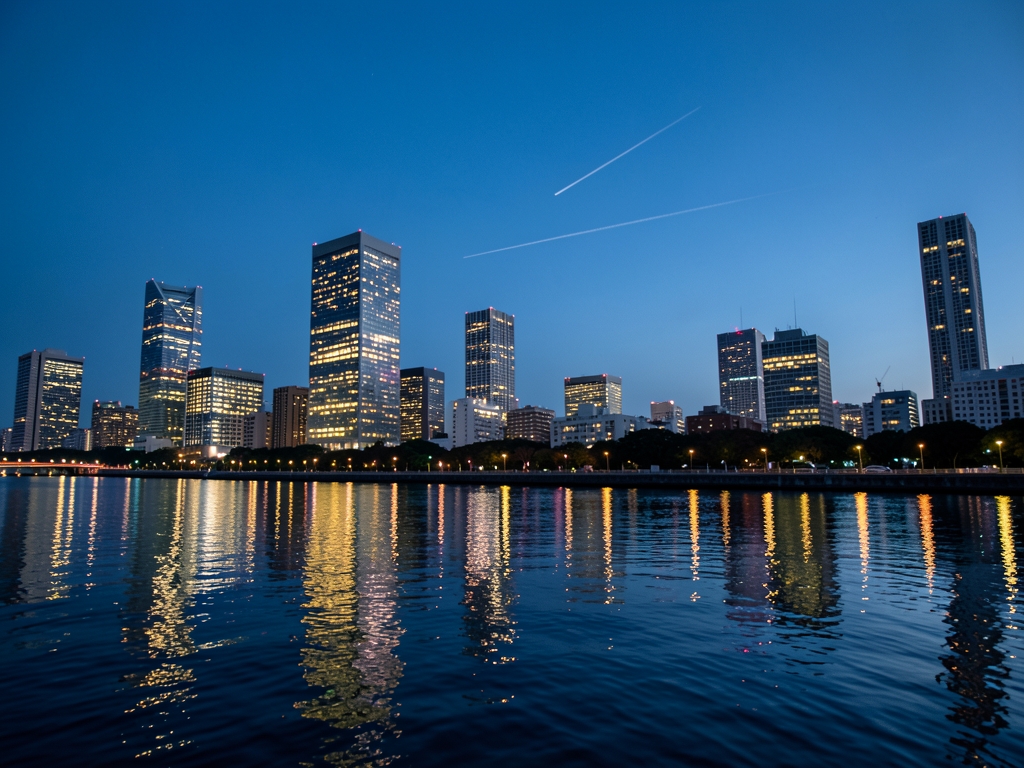 Tokyo skyline twilight with glowing skyscrapers calm river