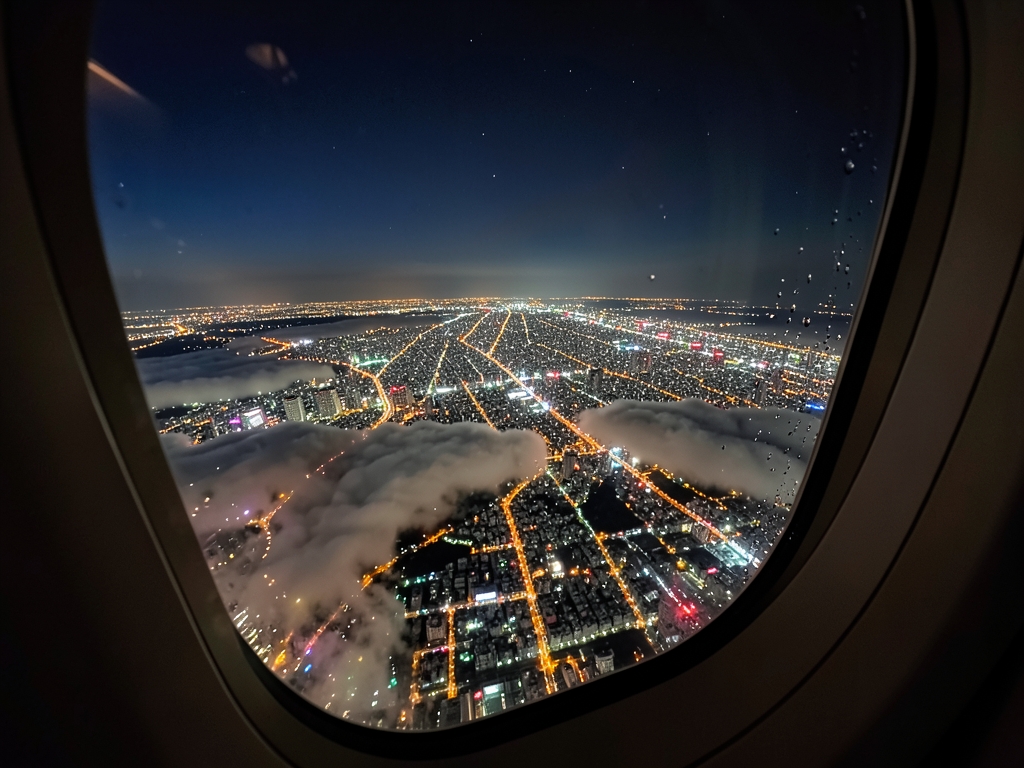 nighttime aerial view Tokyo s dense city grid from