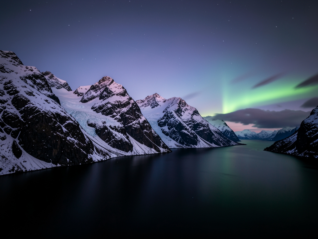 Arctic Tromsø fjord twilight with steep mountains dark