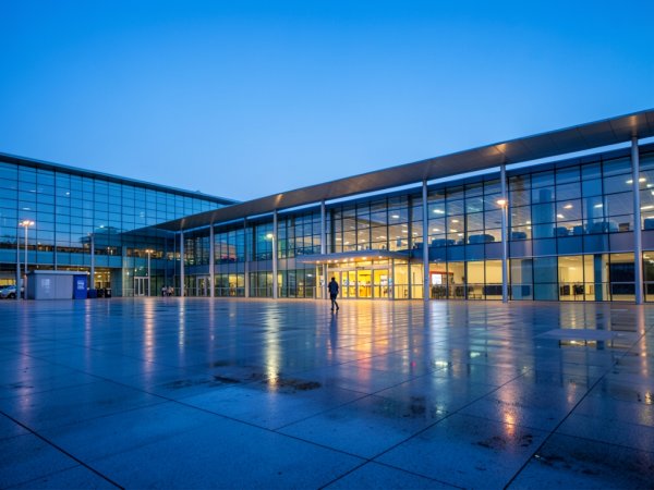 How can you speed up enrollment using airline status benefits