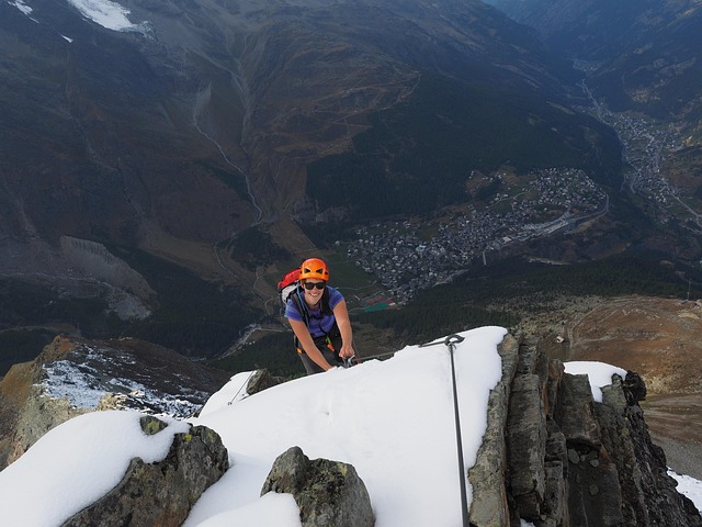 climb via ferrata climber saas fee mountain rope snow nature to back up helmet switzerland valais