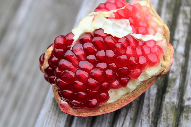 pomegranate exotic fruits fruits cut sliced open seeds nature vitamins red garnet fruit to reduce pomegranate pomegranat