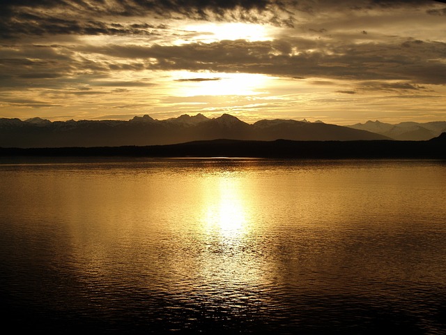 sea sunset silhouette ocean water dusk sunlight sun reflection mountains mountain range scenery scenic countryside natur