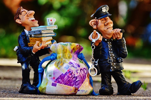 taxes tax evasion police handcuffs fraud tax consultant finance money tax return invoice income tax wealth income tax re