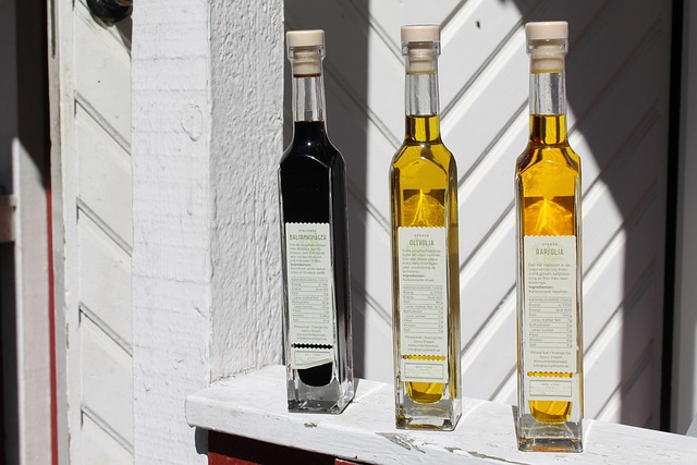 bottles oil vinegar bottle food recipe cork label white yellow dark red salad menu bill of fare restaurant vinegar vineg