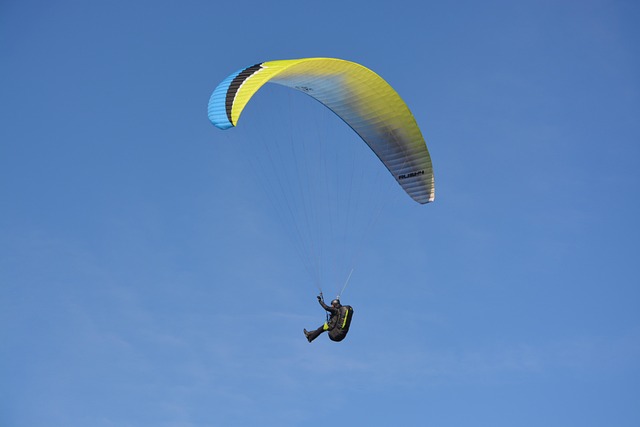 paragliding paraglider sailing blue yellow free flight leisure sports blue sky air flight fly normandy route suisse norm