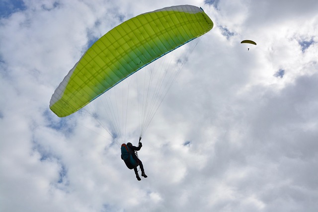 paragliding paraglider wing blue green veil nature free flight sky outside air fly entertainment leisure sports clécy no